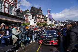 Marco Wittmann, Philipp Eng, Charles Weerts, Robin Frijns, Schubert Motorsport, adenau, nurburgring, blaue ecke, city street, sunny, cloudy, action, parade, bmw m4 gt3, crowd, yokohama, gran turismo, hr, wide angle, eye level, excitement, focus
 | Gruppe C Photography