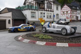 Dennis Olsen, Christopher Mies, Frederic Vervisch, Arjun Maini, HRT Ford Racing, nurburgring, adenau, breidscheid, public road, cloudy, action, ford mustang gt4, silver arrow statue, mercedes-benz w125 replica, crowd, marshals, wide angle, excitement, foc | Gruppe C Photography